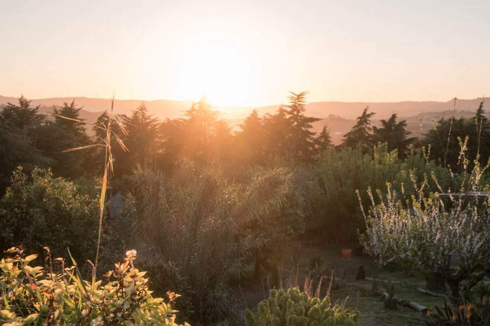 Sunset over the hills above the land