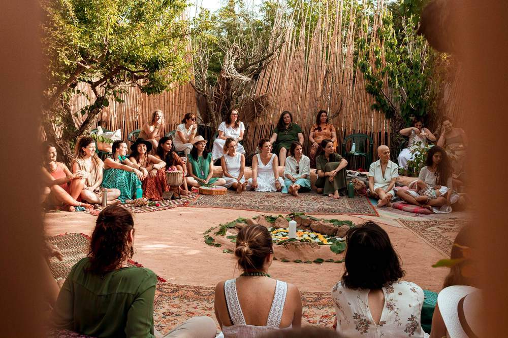 A previous gathering seated in the circle